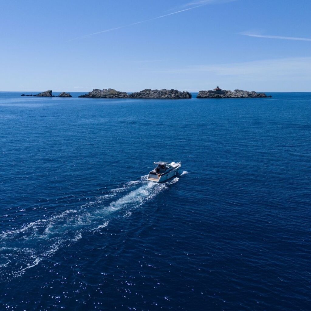 Private boat tour cruising toward Grebeni Island near Dubrovnik on the Adriatic Sea.