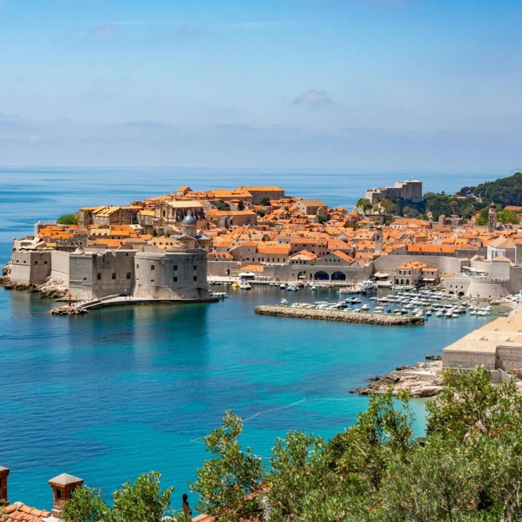 Dubrovnik Old Town and marina overlooking the Adriatic Sea.